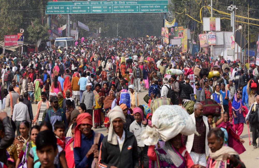 Pilgrims and devotees arrive at the Kumbh Mela for the shahi snan (royal bath) during Mauni Amavasya at Prayagraj (Allahabad), 2019.  The Kumbh Mela transcends the meaning of a traditional fair. It is a massive spiritual gathering, an alignment of cosmic forces, a unique spectacle which attracts pilgrims from all over India and the world.