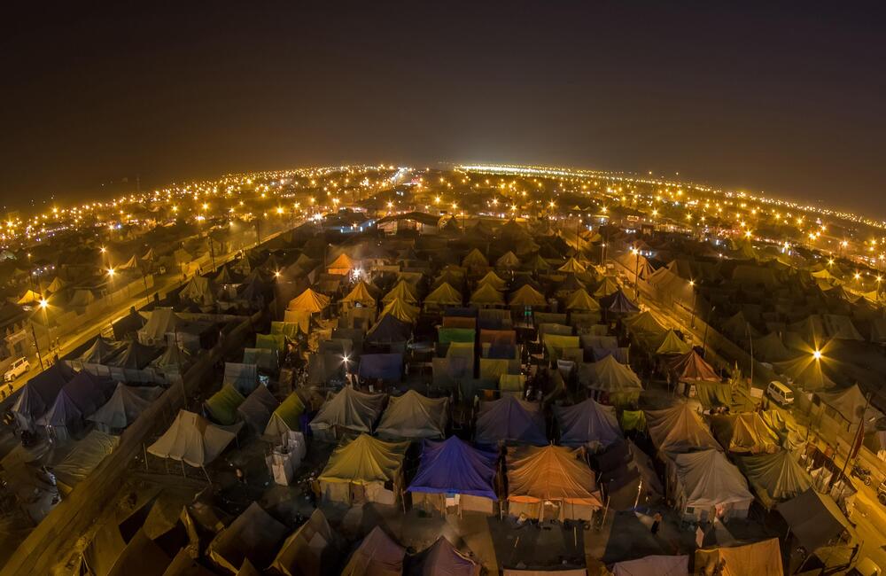 Night-time view of Tent city at Prayagraj Kumbh in 2019. Around 4000 tents equipped with modern facilities and comforts were offered to the visiting devotees for booking. 