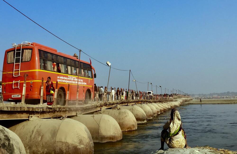 Till next time! People on a pontoon bridge at the Prayag Kumbh, 2019. The Kumbh Mela becomes a temporary site for people to meet and connect for more than a month. A bittersweet time. However, the pilgrims know that the next Kumbh is near-at-hand.