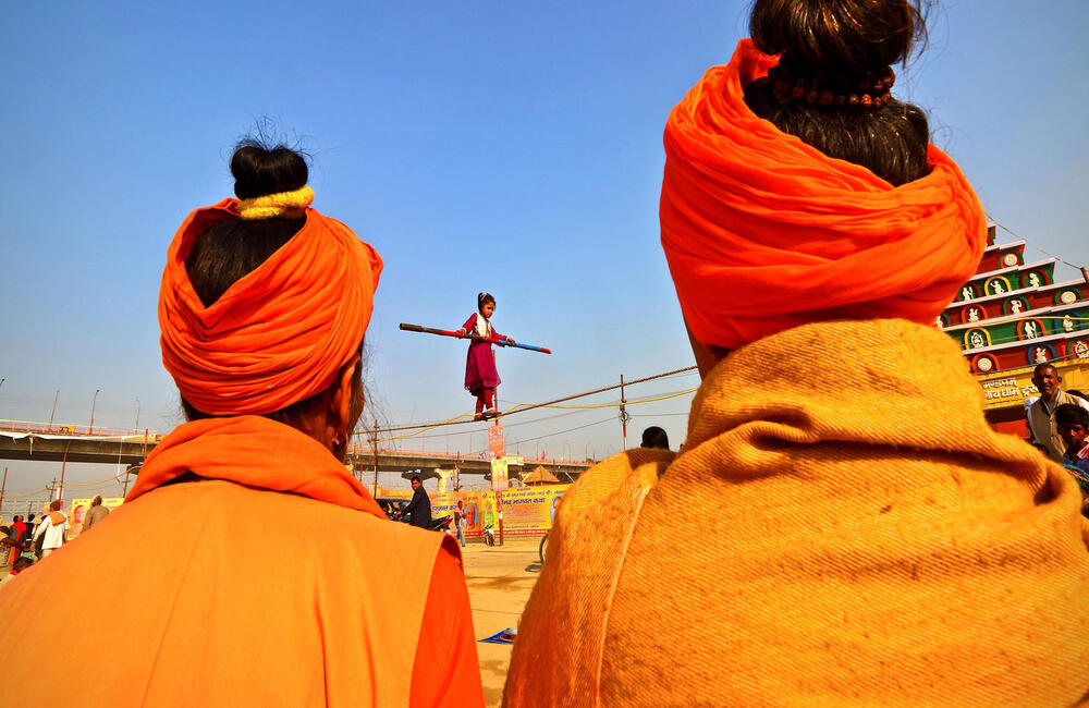 Street performers or nats at the Prayag Kumbh, 2019. The Kumbh is not only a spiritual festival but it offers a variety of cultural experiences to the pilgrims and devotees from massive state-sponsored cultural programmes and exhibitions to traditional mela performances by the nats (performers). Photographer: Yogesh Pal.