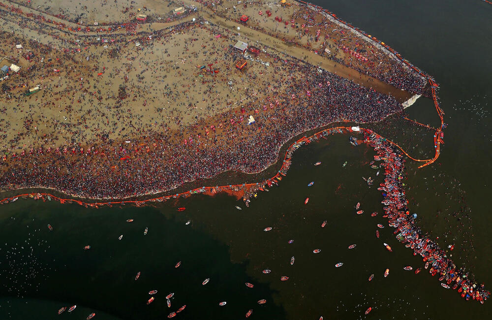 An aerial shot of the 2019 Prayagraj (Allahabad) Kumbh Mela. The Kumbh Mela is widely known as the largest religious gathering in the world.  On account of it being such an exceptional and rich cultural heritage the UNESCO inscribed the mela in its Representative List of Intangible Cultural Heritage of Humanity in 2017. In 2019 alone, around 150 million people are said to have attended the Ardha Kumbh Mela which was held at Prayagraj (Allahabad). Source: Tara Chand Gawariya.